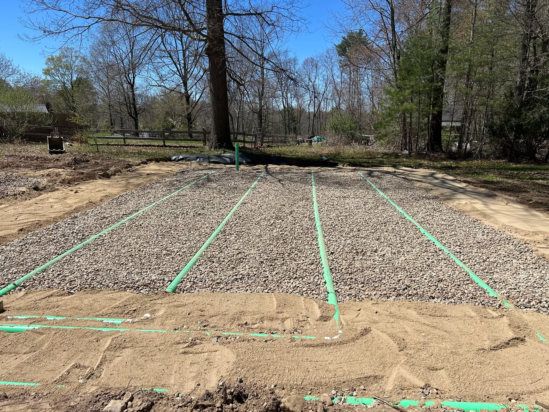 Stone leach field trenches for a full septic system replacement, Belchertown MA